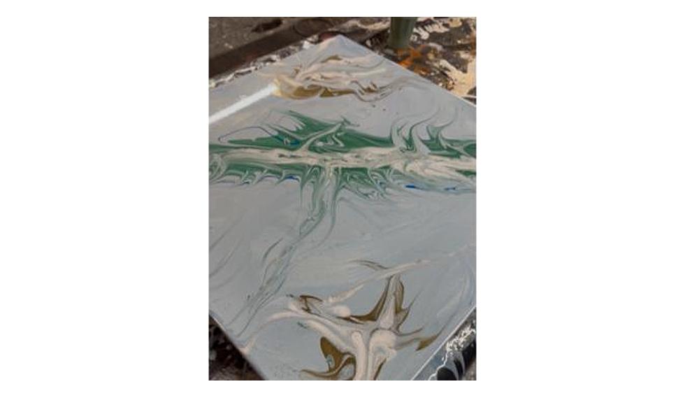 Teal and white marbled resin pour